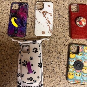 3 iPhone 11 Pro Loopy Cases and 2 iPhone 11 Pro pop socket cases.
